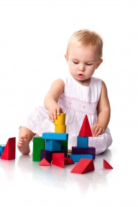 Beautiful baby building a castle