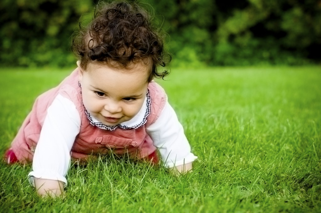 Baby Girl ( 8 months old ) Crawling On Grass